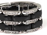 a black and white bracelet with diamonds on it