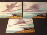 three paintings of boats on the shore of a lake under a cloudy sky