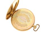 a gold pocket watch with a gold case on a white background