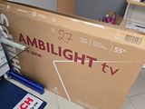 a box that is sitting on the floor in front of a tv