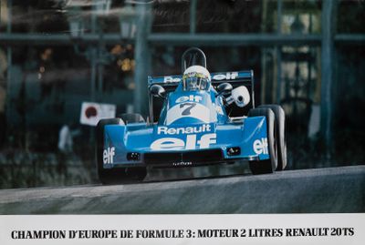 a picture of a blue race car driving down the street