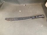 a knife that is sitting in a box on the floor