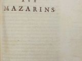 an old book that is open on a table