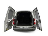 the back of a silver van with its doors open on a white background