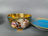 two bowls and a bowl with a painting on them