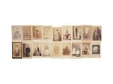 several old photographs of people are displayed on a white surface