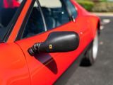 an image of a red sports car parked in a parking lot