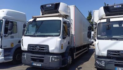 three trucks that are parked in a parking lot