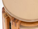 a stack of plates sitting on top of a wooden table