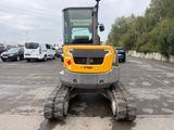 an image of a construction vehicle parked in a parking lot