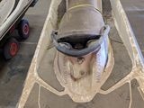 a small boat that is sitting in the garage