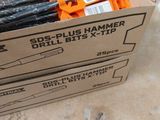 a cardboard box with scissors and a pair of scissors in it