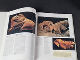 an open book with pictures of animals on it