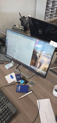 an image of a desk with a computer monitor and keyboard