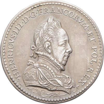 une image représentant une pièce d'argent sur laquelle figure le portrait d'un homme