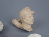 a statue of a man with a hat and a hat on
