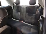 the back seats of a car are black and grey in color