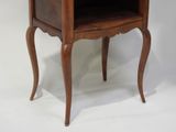 a small wooden table with a drawer on it