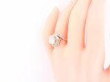 an image of a woman ' s hand with a diamond ring on it