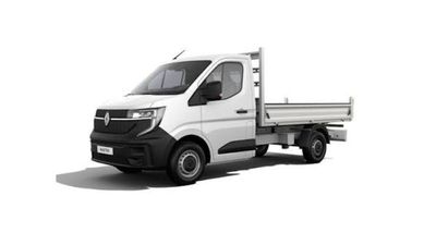Le camion blanc est garé sur le bord de la route.