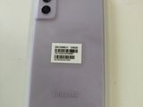 an image of a purple samsung phone with a barcode on the back of it