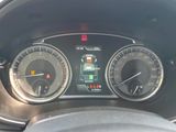 a close up of a car dashboard with various gauges
