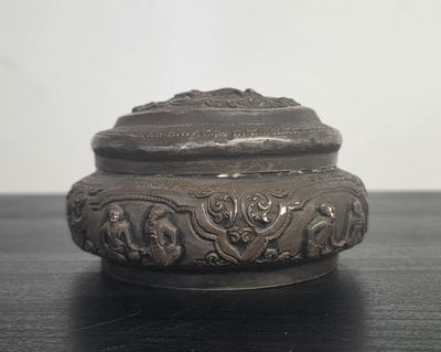 a small metal box sitting on a table