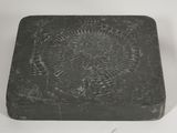 a black box with a design on it on a white surface