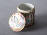 a cup with a lid sitting on a table
