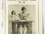 two children sitting at a table in front of a sewing machine