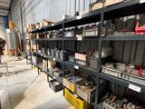 a room with a lot of shelves and bins on it