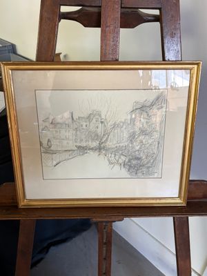 une photo d'une photo d'une ville posée sur un chevalet