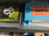 a lot of books on a shelf in a store