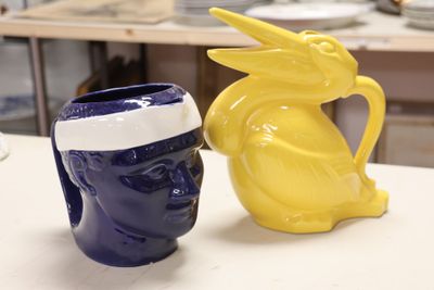 two vases that are sitting on a table