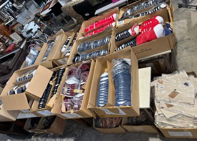 many boxes of sodas and water bottles on the ground