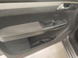 the interior of a car with the door open and the driver ' s seat down