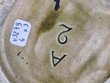a picture of a plate with a number on it
