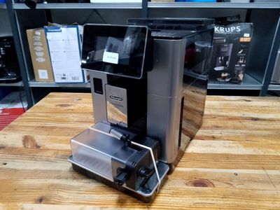 a coffee machine that is sitting on a wooden table
