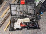 a tool box with tools in it sitting on the floor