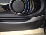 a close up of a speaker in a car door