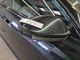 an image of a car with a sticker on it ' s side mirror