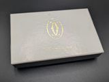 a close up of a white box with a gold logo on it