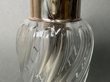 a glass jar with a metal lid on a table