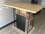 a wooden table with a black cabinet underneath it