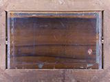 a wooden frame with a mirror on it