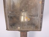 an old fashioned street light on a metal pole