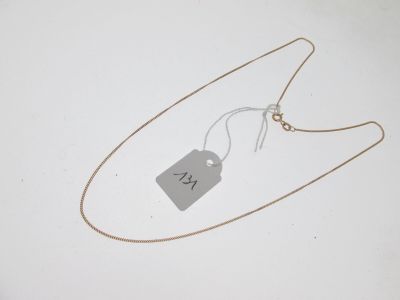 gros plan d'un collier auquel est attachée une étiquette