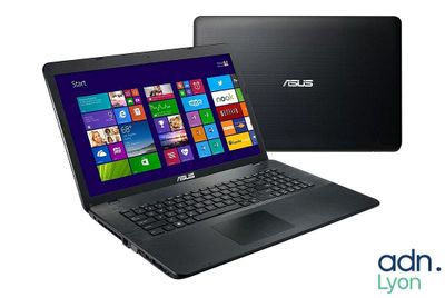 un ordinateur portable noir avec un écran Windows 8 à côté