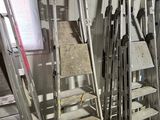 many ladders that are leaning against the wall