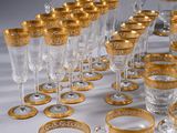 a lot of glasses that are sitting on a table